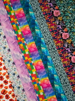 Elias Baumwolljersey Blumen Blaetter Buchstaben Regenbogen h1