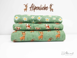 MrsMintDesign Alpenliebe Baumwolljersey Blueten Kuehe Steinboecke batik aquarell gruen 344603 351603 347603 q2 Typo