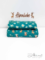 MrsMintDesign Alpenliebe Baumwolljersey Wiesenblumen Kuehe Steinboecke Ziege Floral petrol 345747 346747 h1 Typo