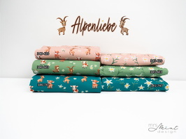 MrsMintDesign Alpenliebe Baumwolljersey Kuehe Steinboecke Floral apricot gruen petrol q2 Typo 2n